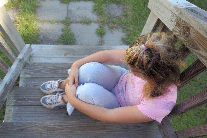 child mental health girl on steps