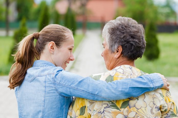 Old and young woman make personal budgets dementia friendly