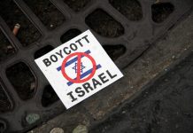 council boycotts israel sign on floor