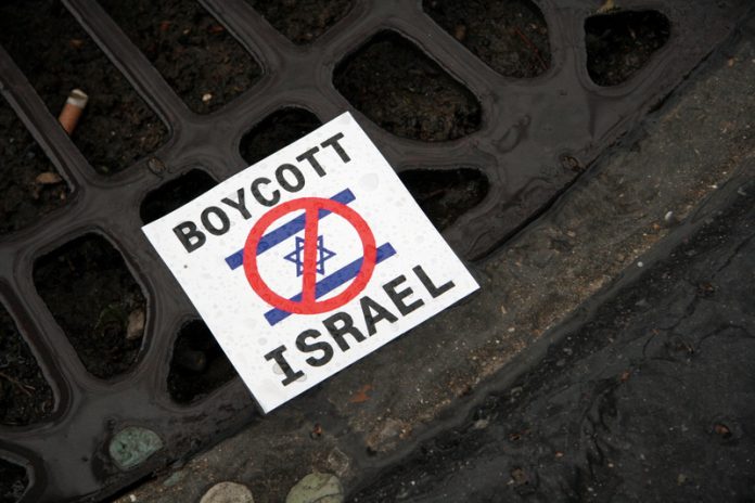 council boycotts israel sign on floor