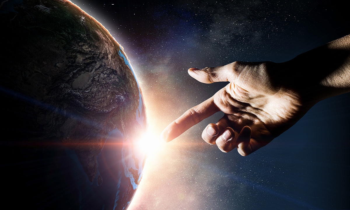 Hand in space pointing at a planet