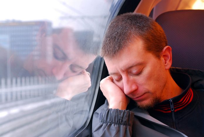 man napping on the train
