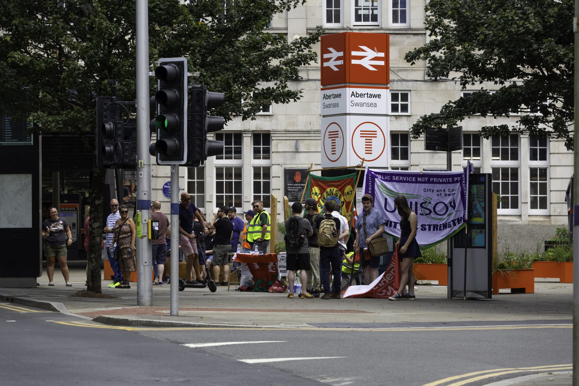 Editorial Swansea, UK - June 23, 2022: Pickets at Swansea High Street rail station during the RMT official rail strike