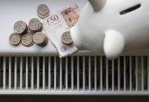 money on a radiator indicating expensive energy bills