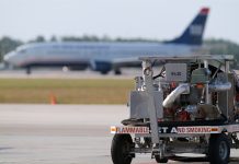 aviation plane in the background with jet fuel in the foreground