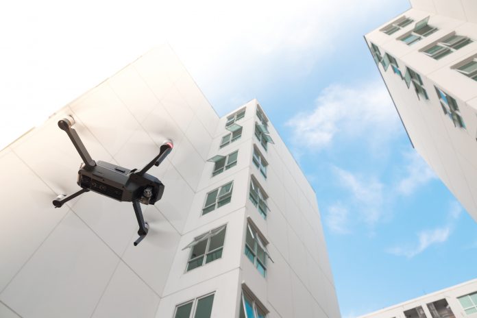 Delivery drones outside a hospital building