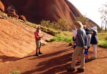 Indigenous man guiding people in Australia