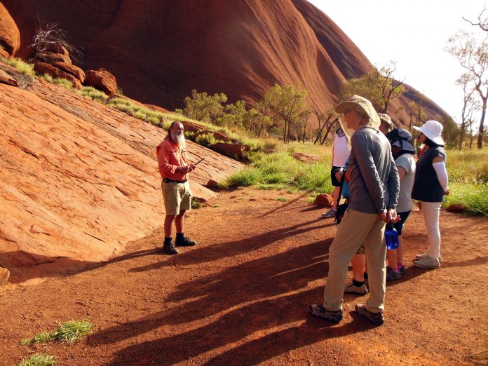 Indigenous man guiding people in Australia