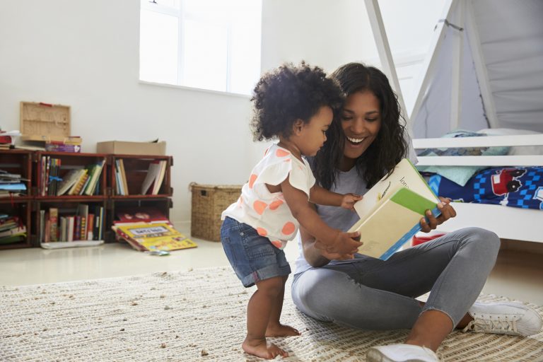 mother and daughter reading a book