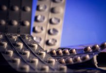 Antidepressant pills on a blue background