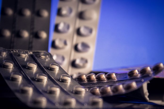 Antidepressant pills on a blue background