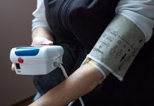 Woman taking her blood pressure