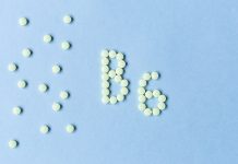 Vitamin B6 tablets forming the word 'B6' on a blue background