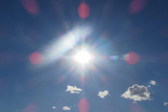 a picture of the sky with the sun in the centre, illustrating the heatwave
