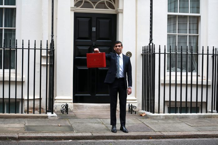 Rishi Sunak standing outside No. 10 Downing Street