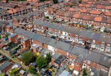 Aerial view of rows of terraced houses in the North of England indicating levelling up