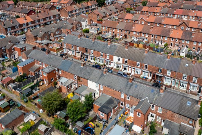 Aerial view of rows of terraced houses in the North of England indicating levelling up