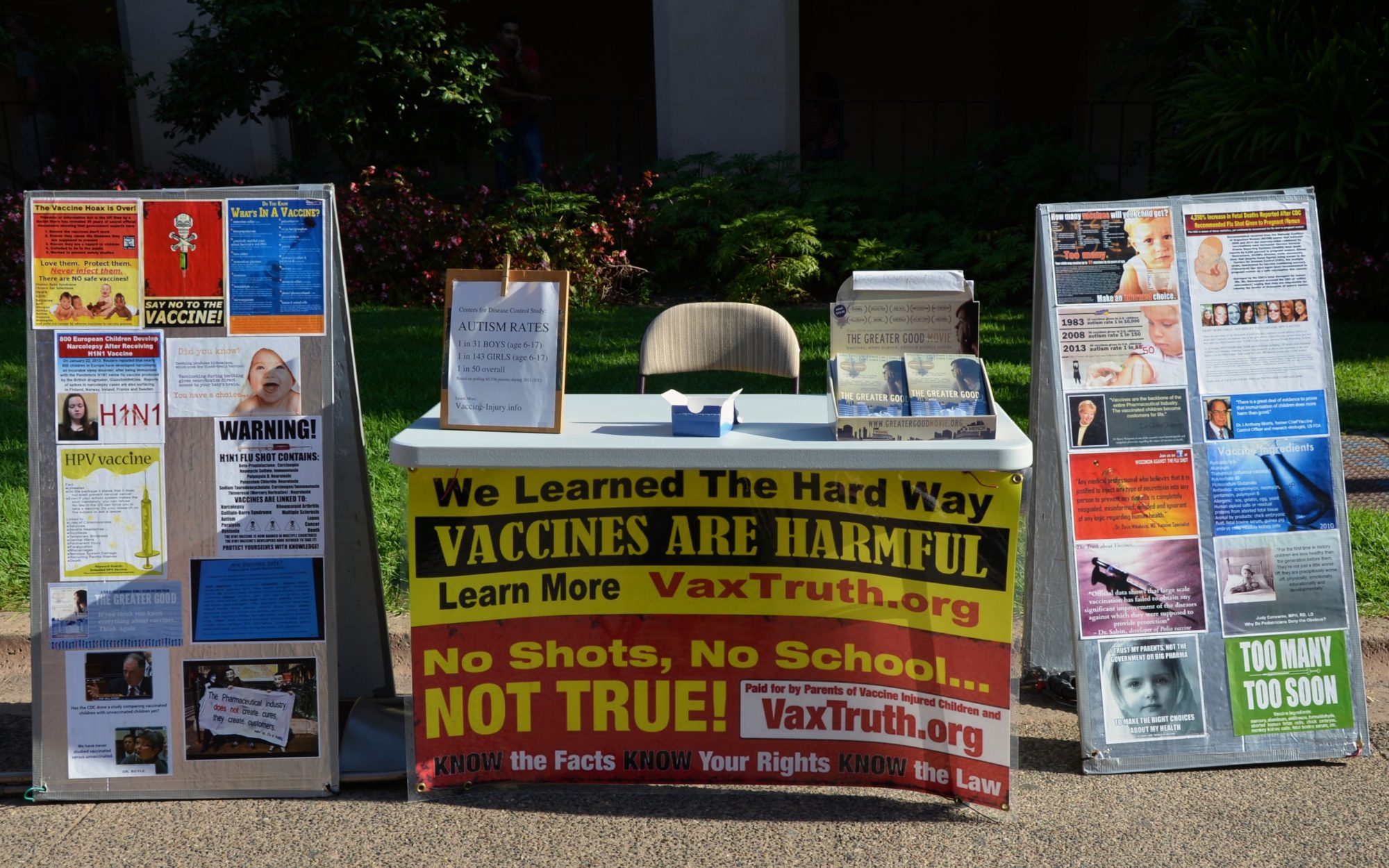Anti-vaccine booth on street with leaflets and information