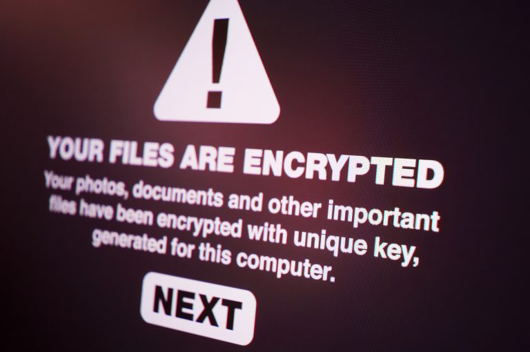 Computer message from ransomware hacker stating 'YOUR FILES ARE ENCRYPTED'