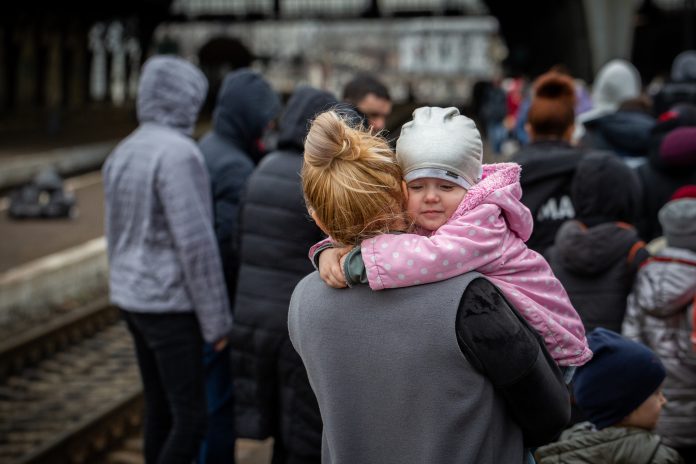 Woman with young child in crowd