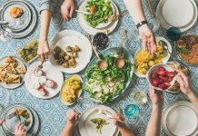 Mediterranean style dinner with various snacks and drinks, wide composition