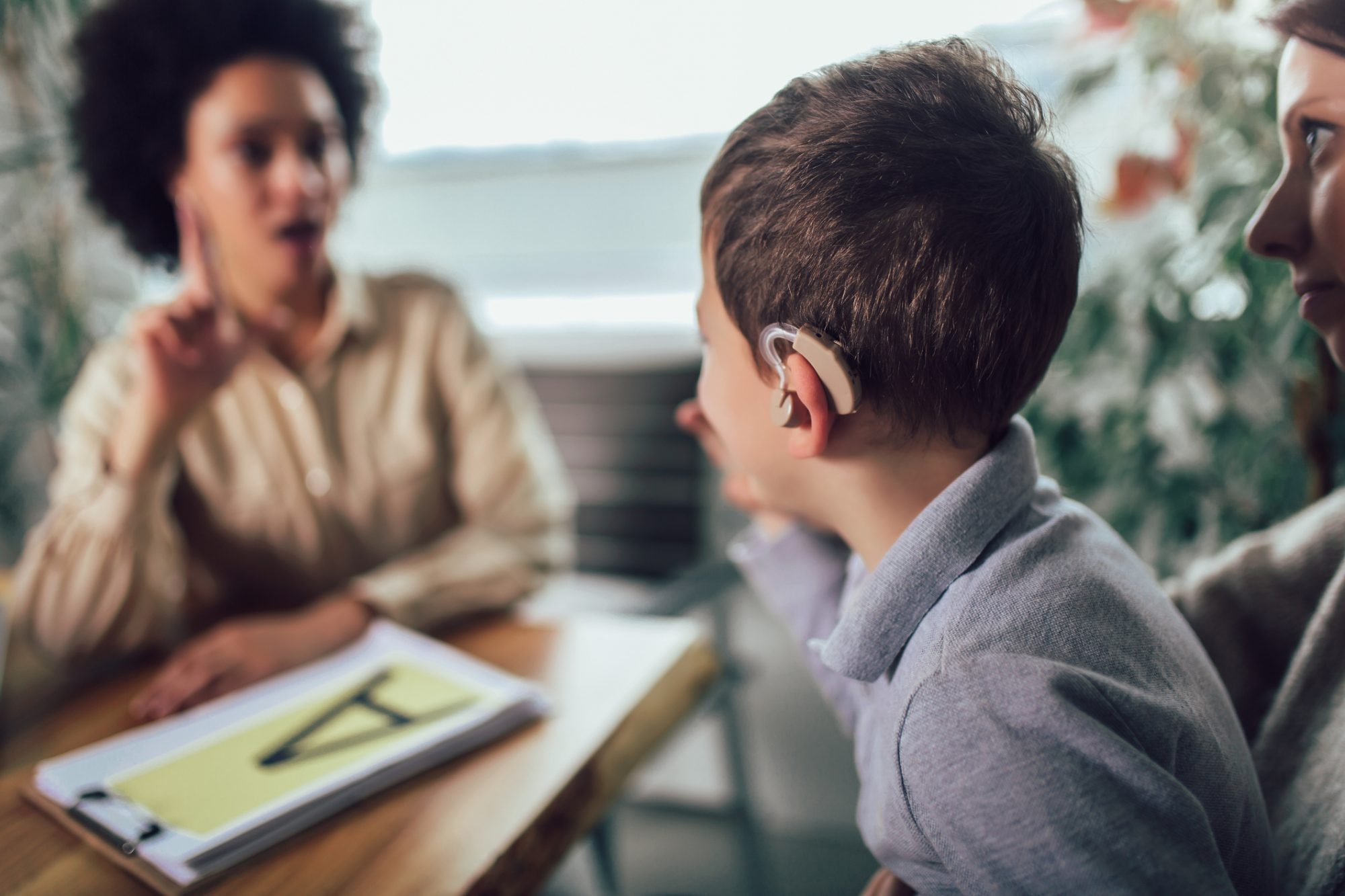 Disabled child learning sign language at school