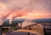 Smokestack pipe factory pollution in the city, Fuel Power Plant Smokestacks Emit Carbon Dioxide Pollution