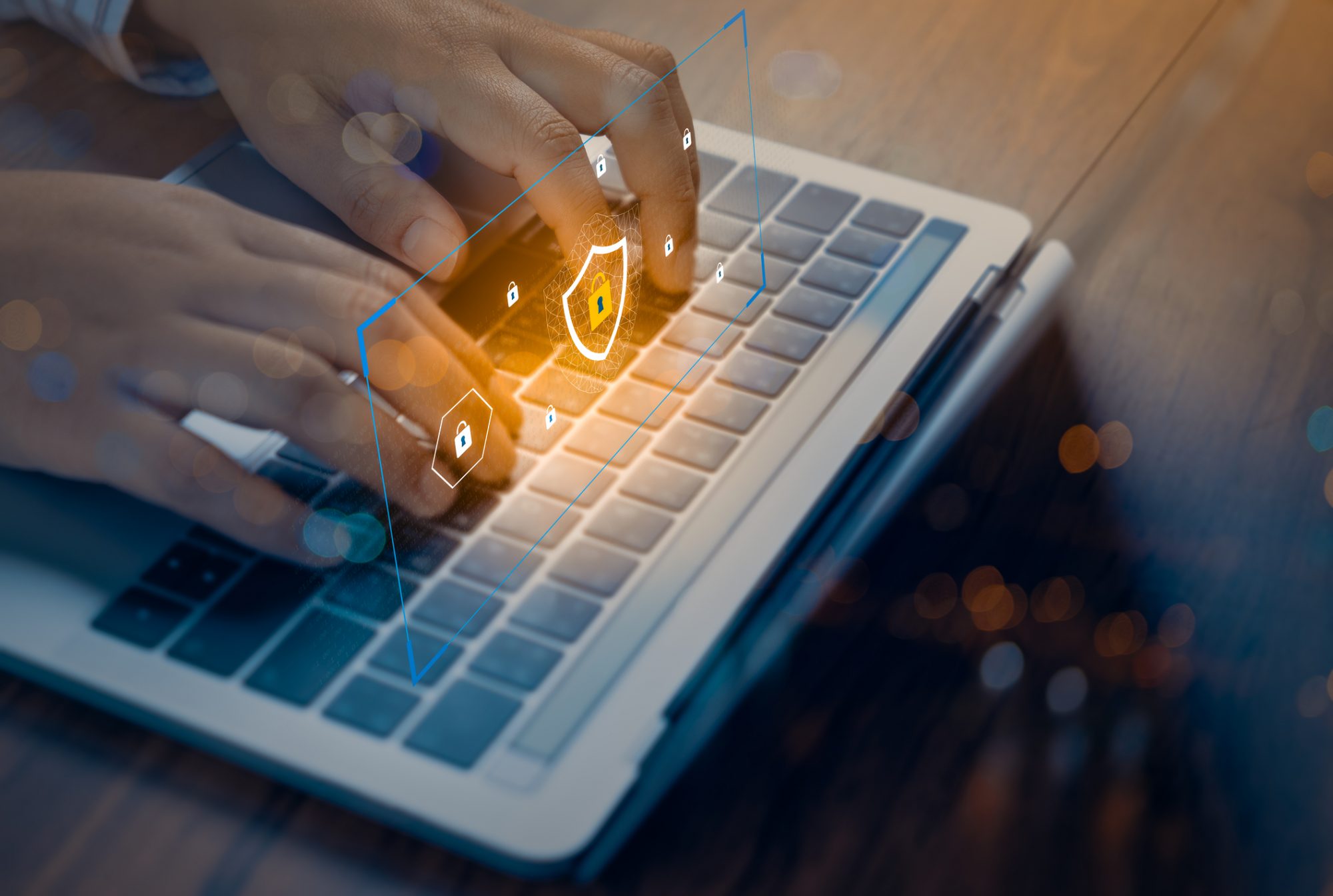 Person using a laptop computer with technology cyber security