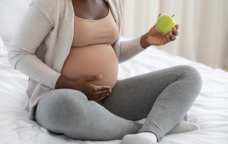 Pregnant woman eating food