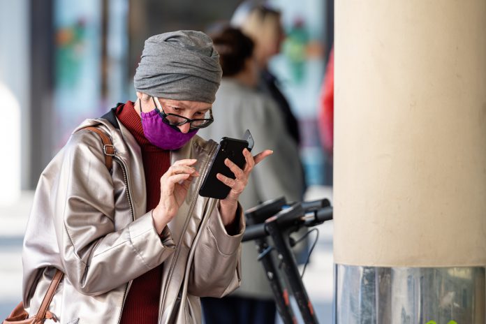 Older patient on phone