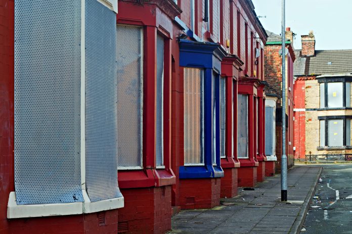 A street of boarded up derelict houses in Liverpool