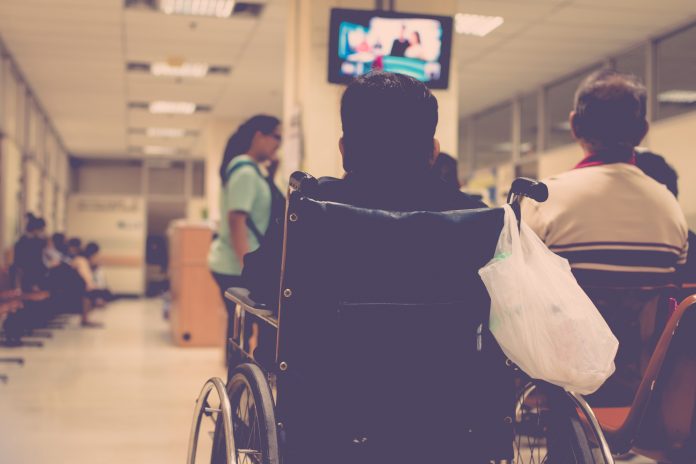 Patient waiting for a doctor in a NHS hospital