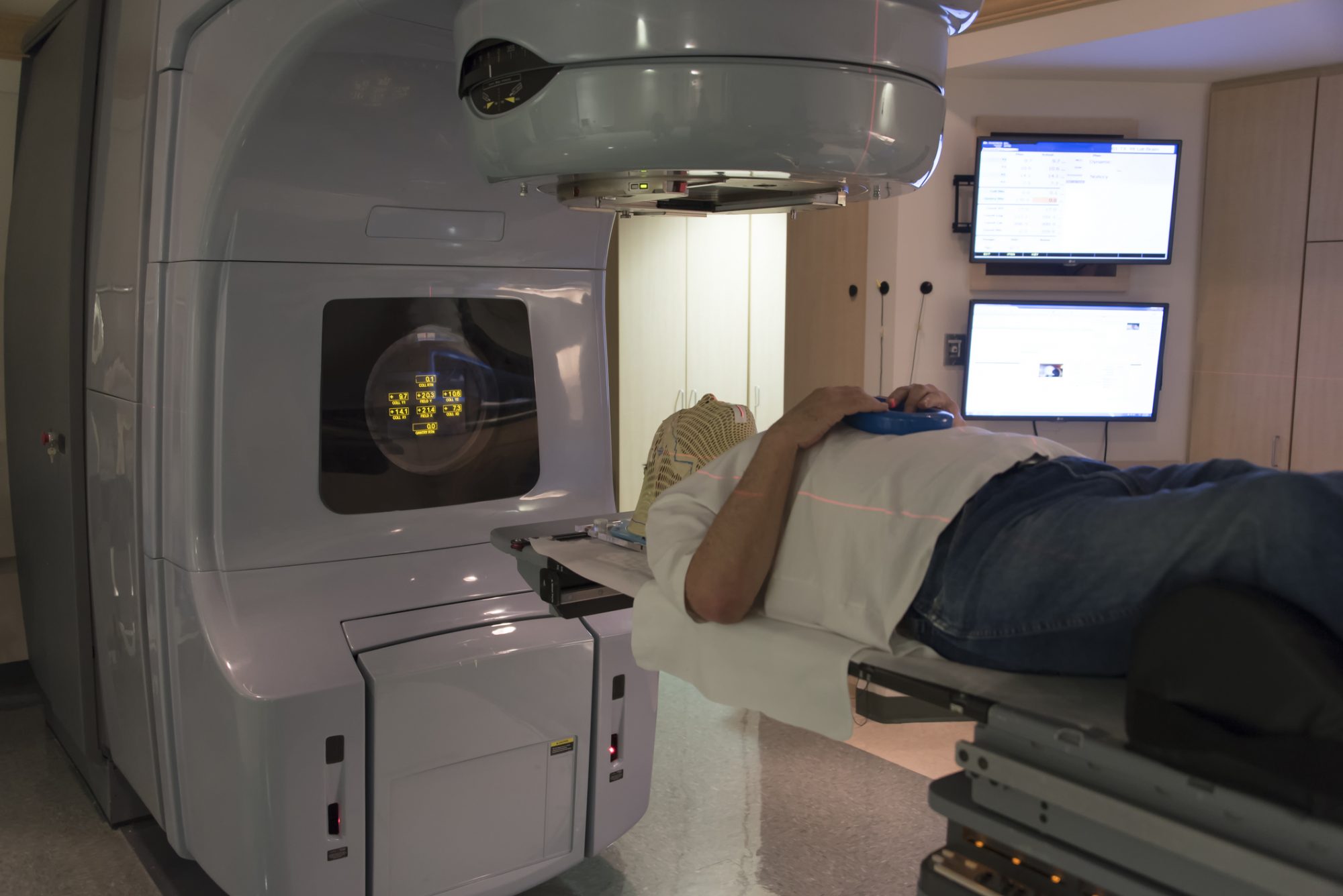 Patient Radiation therapy mask showing laser lines for targeting cancer cells in the brain