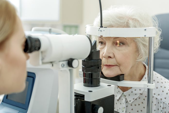 woman having an eye test done at the optician