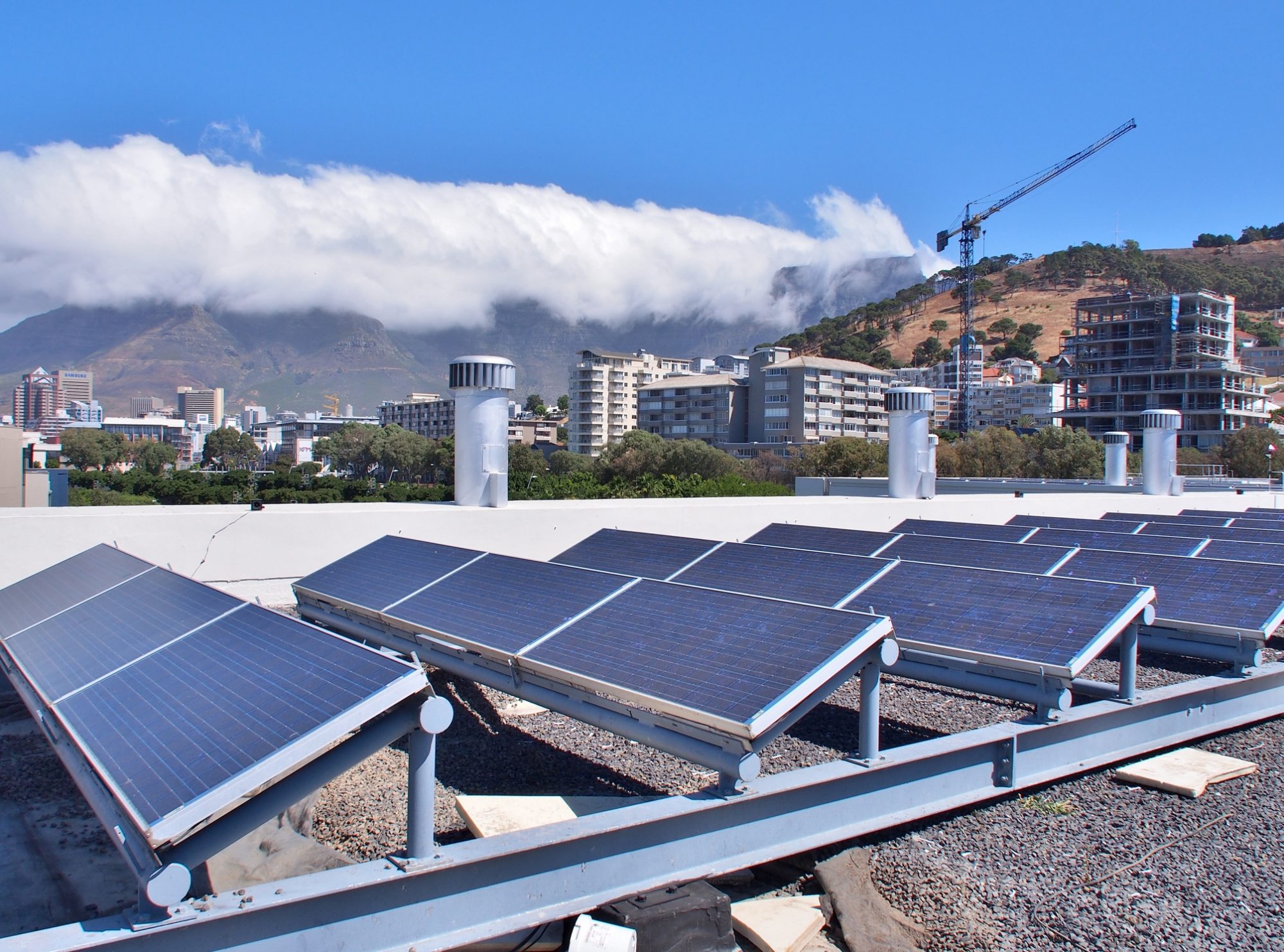 Solar panels or Solar cells on rooftop or terrace of building in Cape Town, South Africa. Can saving energy. Green or Sun or renewable or Clean energy.