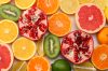 healthy food. mix sliced lemon, green lime, orange, mandarin, kiwi fruit and grapefruit isolated on white background