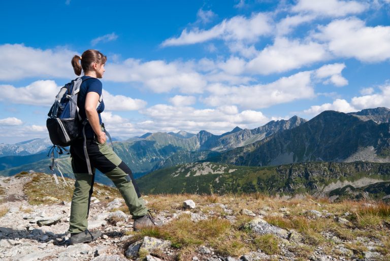 Young woman hiking in mountains