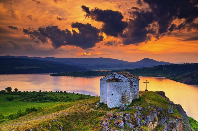 Sunset over Saint Joan Letni chapel near Pchelina dam, Bulgaria