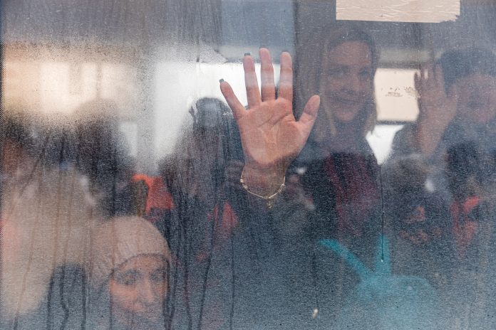 Ukrainian refugees photographed behind steamed up glass