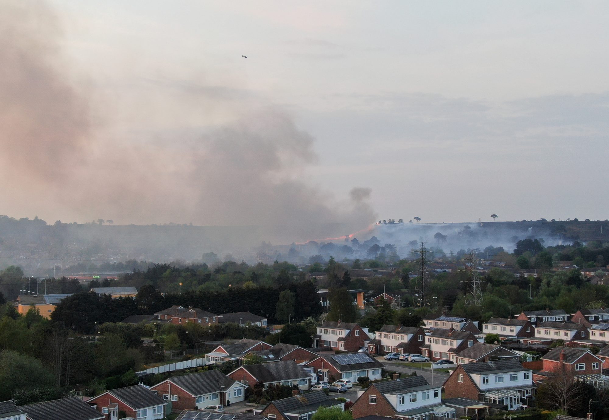 Dangerous wildfire spreading on heathland near houses in Poole, Dorset 2022