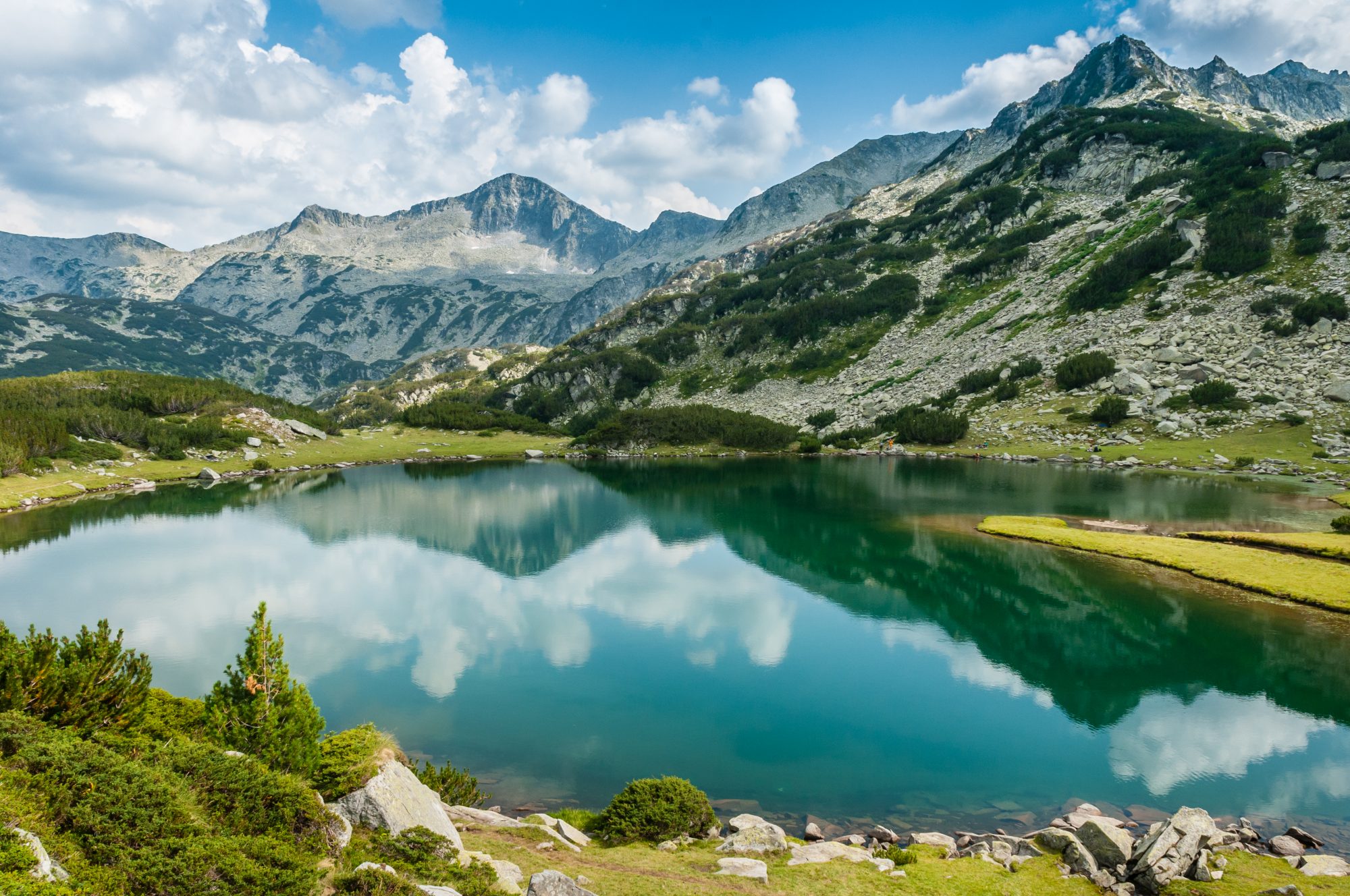 Lake and mountain with water reflection shot in Bulgaria in Pirin National Park