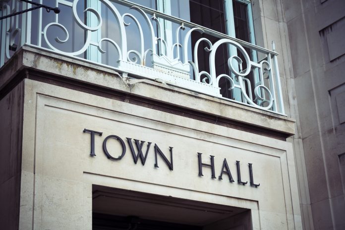 Town hall sign on building