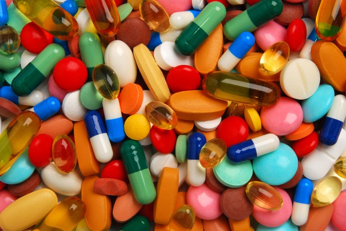 Pile of pills, new drug development - Acoustic Cluster Therapy