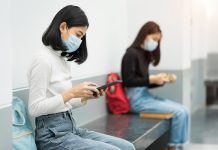 Two female college students wearing masks