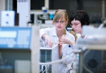 Females in a chemistry lab doing research