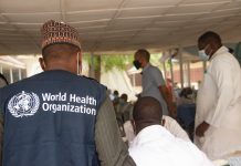 world health organisation worker in Africa during covid-19