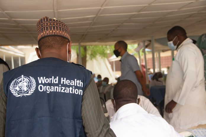 world health organisation worker in Africa during covid-19