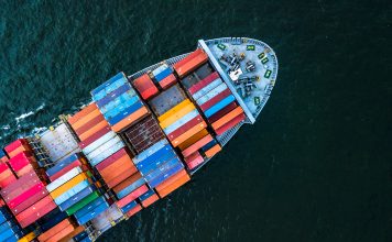 Aerial top view crane shipping container, cargo container ship carrying container import and export business logistic and transportation
