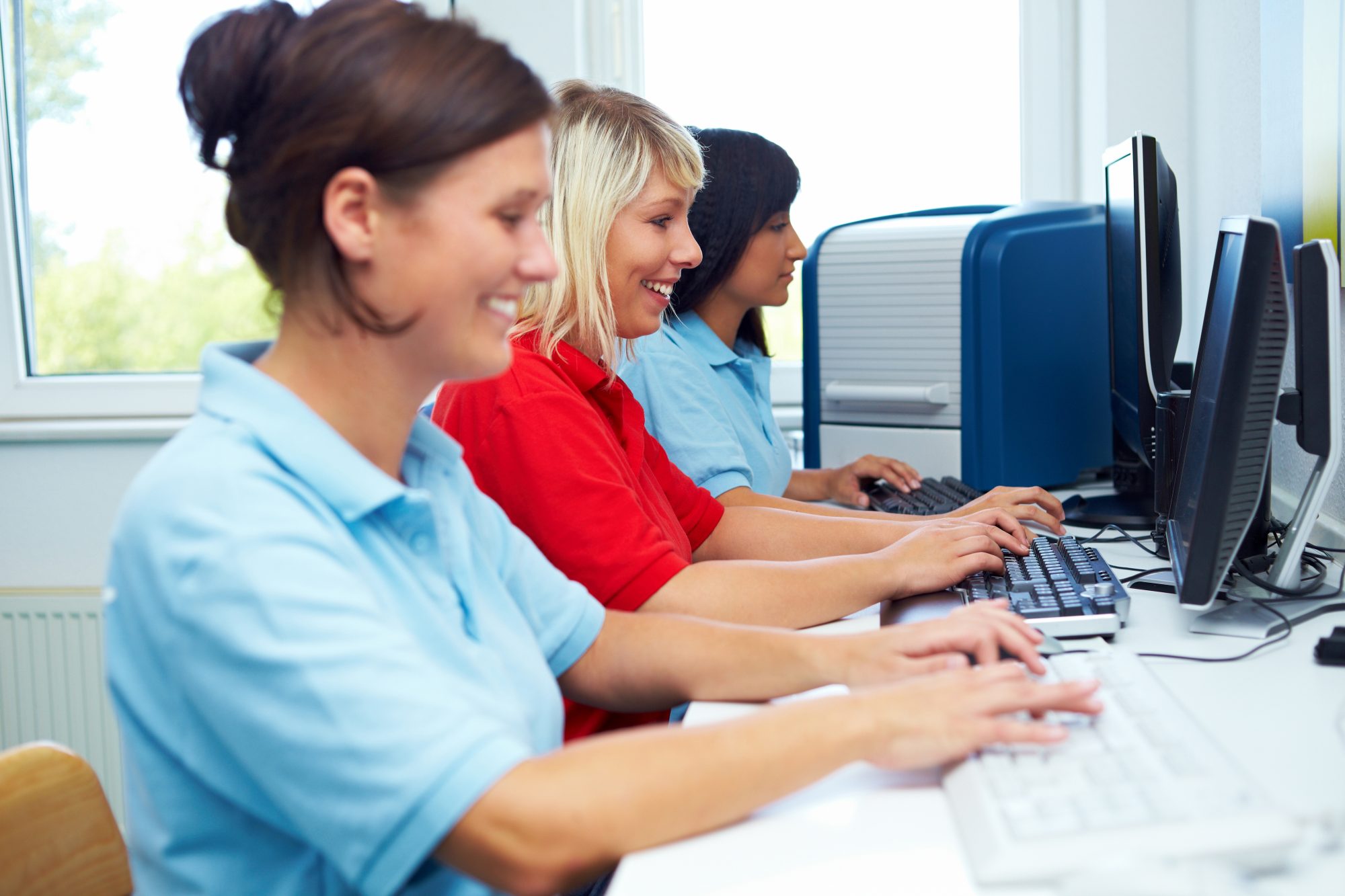 Women sitting working on computers