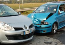 Silver and blue car crashed into each other